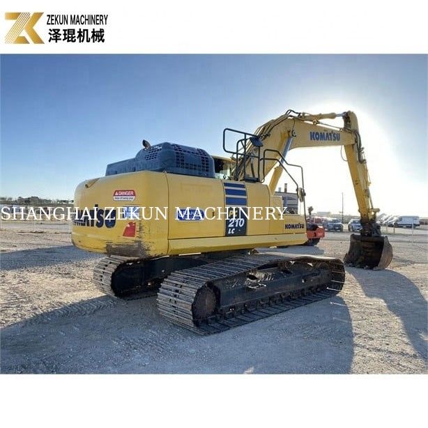 Excavatrice à rouleaux utilisée Komatsu PC 210-LC 7 avec plaquettes en caoutchouc 20900 KG